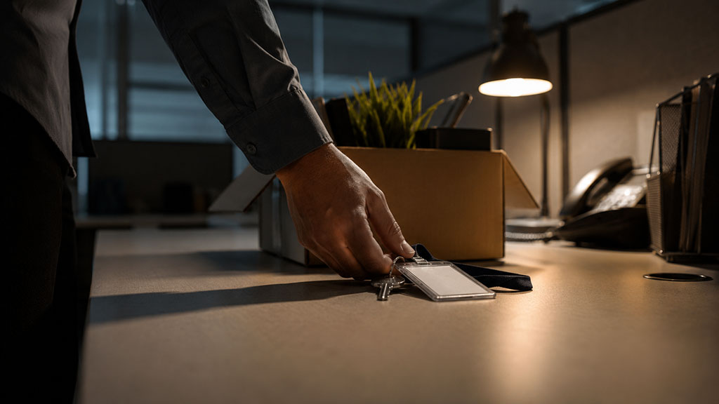 Employee's desk cleared out after losing a job while on Delaware workers' comp leave